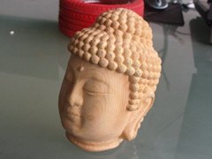 Голова Будды трехмерной резьбы